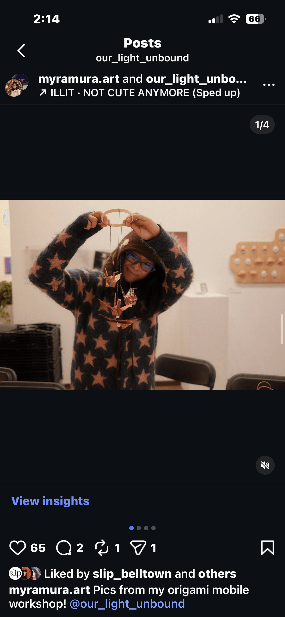 Instagram post from an origami mobile workshop at the exhibition, showing a participant holding up their completed origami mobile, tagged @our_light_unbound